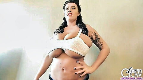Curvy brunette in white lace pinup bra, huge overflowing tits, seductive pose
