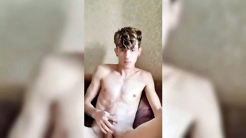 Slim young Caucasian guy with curly hair posing nude solo masturbation