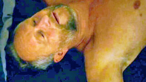 Mature bearded man lying nude on bed in Inexorable (2021) scene