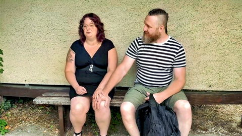 Sabbat Freyja, 32, curvy redhead in black dress with bearded partner
