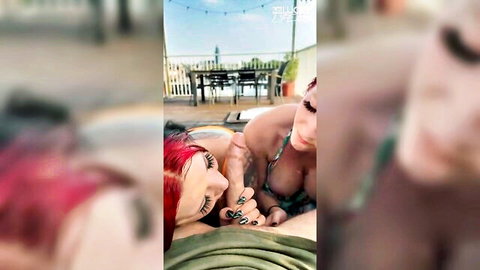 Two busty women in bikinis lounging sensually on balcony for threesome fun