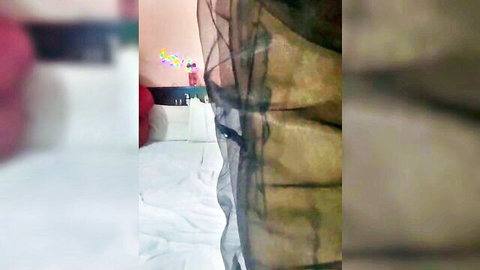 Tattooed brunette MILF spreads legs wide for red vibrator pussy insertion on bed