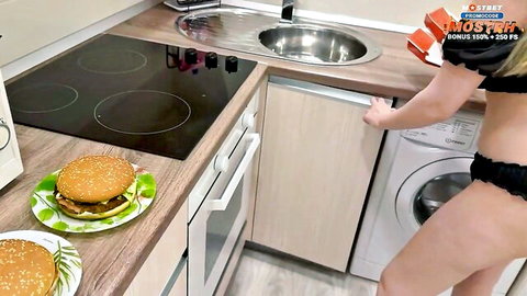 Blonde big ass woman bending over kitchen counter in black thong panties teasing next to burgers