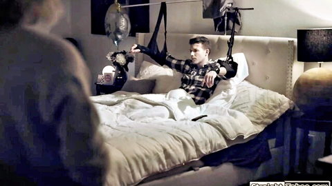 Hot MILF stands over restrained young stud in taboo BDSM bedroom domination