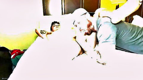 Red-bearded man in cap fucks dark-haired guy's ass in gay anal sex on bed