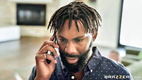 Black hunk with dreadlocks and beard talking on phone in luxurious living room Brazzers scene