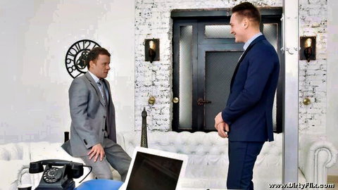 Jessica Lincoln in suited business negotiation scene with two men