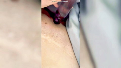 Close-up of woman masturbating with toy insertion