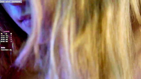 Seductive close-up of blonde Alexandra Demore's glossy lips and flowing hair