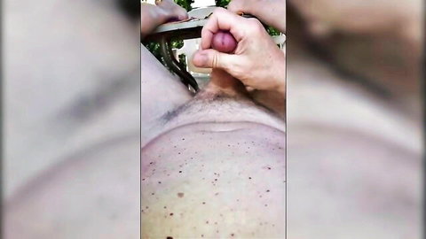 Outdoor handjob in hammock on young guy with massive cock