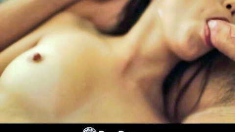 Topless woman with perky tits and visible nipple sucks man's finger sensually