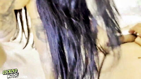 Purple-haired cougar with tattoos in sensual side profile tease