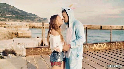 Taylor Sands in romantic outdoor kiss wearing off-shoulder top and denim shorts