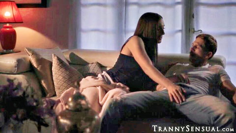TS Melanie Brooks teases Roman Todd on couch in tank top and shorts