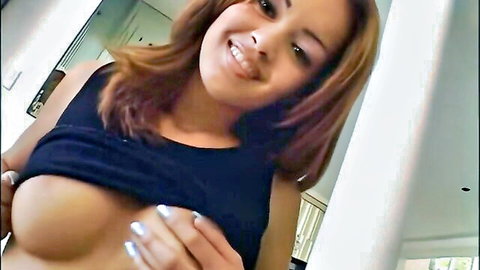 Daisy Marie smiling while flashing her big perky tits in black tank top