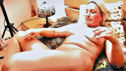 Blonde curvy woman with big boobs nude on bed, swinger party scene