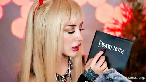 Lizzie Lestrange as Misa Amane taunts with Death Note in gothic cosplay
