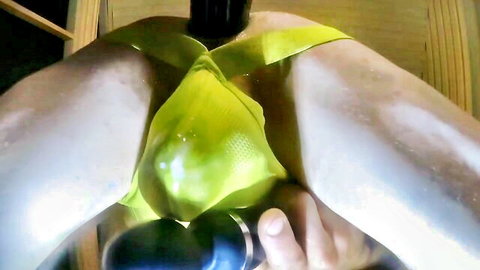 Sissy in shiny yellow lingerie spreads legs for closeup black dildo anal insertion