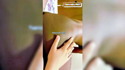 Fair hand squeezes juicy big brown ass cheek closeup