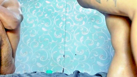 Muscular tattooed guy standing naked from behind exposing bare ass in bathroom mirror selfie