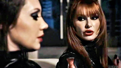 Kenzie Taylor and Elena Koshka in seductive black latex outfits, intense eye contact