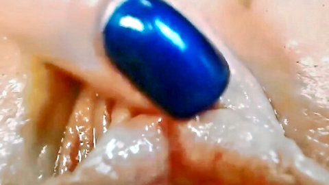 Closeup of soaking wet shaved pussy with blue nail polish
