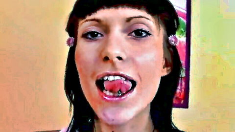 Pierced tongue teen with tight body opens mouth wide, going topless