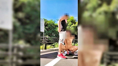 Censored Japanese woman masturbating semi-nude in outdoor parking lot