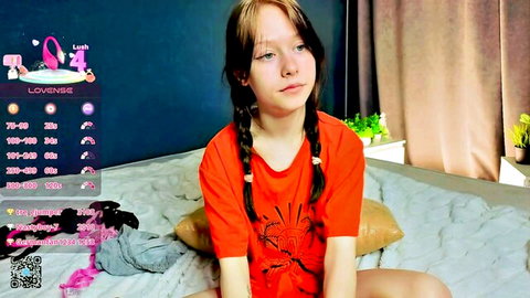 Joyce Murphy shy redhead teen with pigtails in orange tee on cam