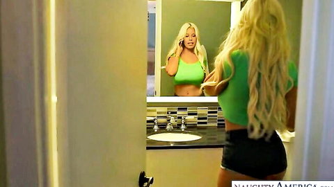 Bridgette B sexy blonde MILF with huge tits posing in mirror