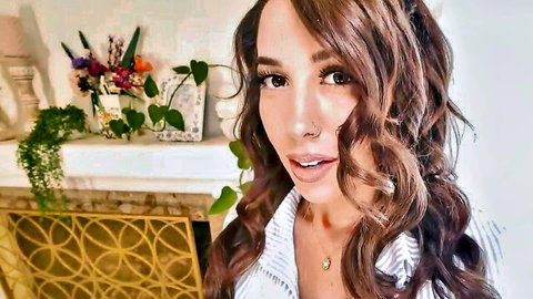 Sexy brunette with cleavage teasing in unbuttoned white shirt POV