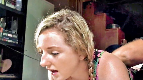 Sweaty blonde with braids in pink top gripped tightly by man's arm intense moan face