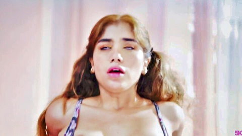 Marina Gold close-up in passionate scene with Chris Torres, seductive expression and cleavage
