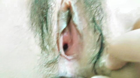 Close-up of hairy Chinese teen vulva in explicit amateur view