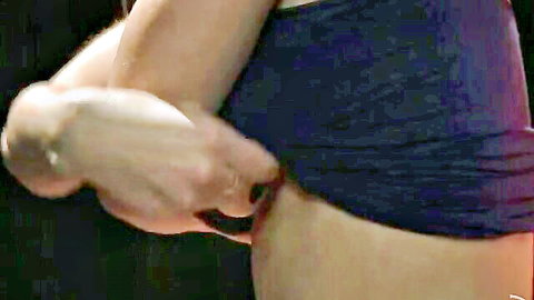 Man's hand pulling down woman's black panties exposing her juicy ass cheeks