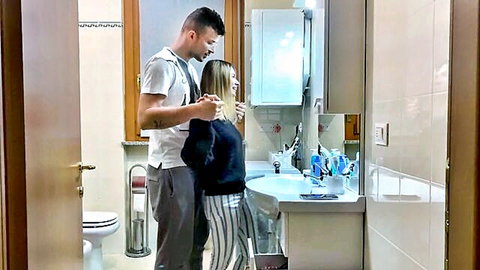 Amateur blonde girlfriend bent over bathroom sink as boyfriend holds her hair intimately