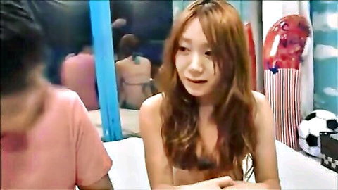 Japanese woman topless with long brown hair in intimate JAV scene