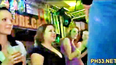 Young women dancing in neon-lit club, partying before intense fun