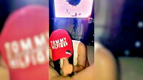 Hot stepsister in red Tommy cap seduces with blowjob in amateur video