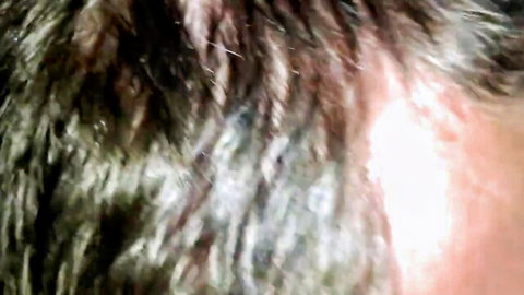 Close-up of woman with messy blonde hair sucking Harley dick intensely