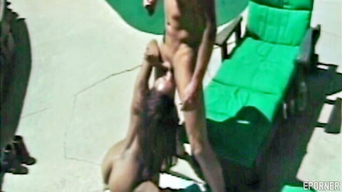 Ebony babe giving blowjob to muscular guy outdoors, nude poolside sex