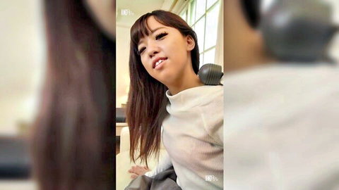 Petite Japanese girl with small tits smiling teasingly with microphone closeup