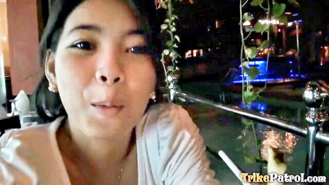 Seductive Asian woman smiling in TukTuk Patrol adult video thumbnail