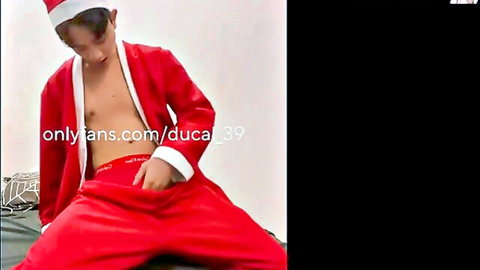 Cute Asian twink in open Santa robe teasing hand in pants solo