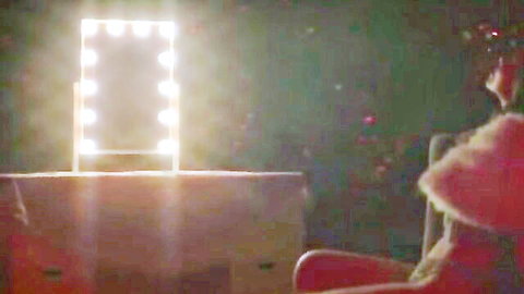 Denise Esteban in pink dress at vanity mirror, Star Dancer (2023) nude tease