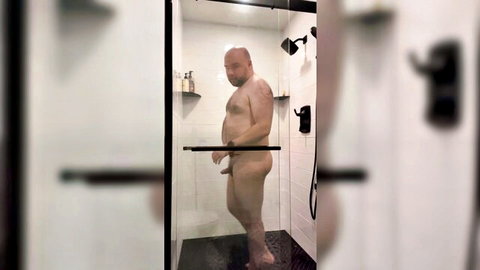 Naked bald chubby man exposing himself in shower solo