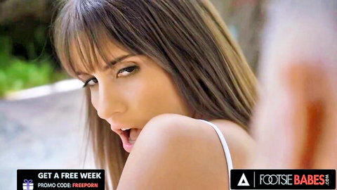 Lili Charmelle seductive closeup, open mouth, white top, foot fetish tease