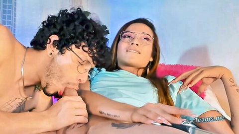 Curly-haired man sucks trans woman's dick in intimate oral scene