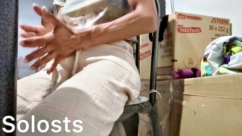 Amateur solo man sitting at home in beige pants, teasing near-masturbation