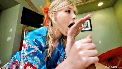 Blonde in floral kimono teases blowjob with open mouth tongue out and spread fingers